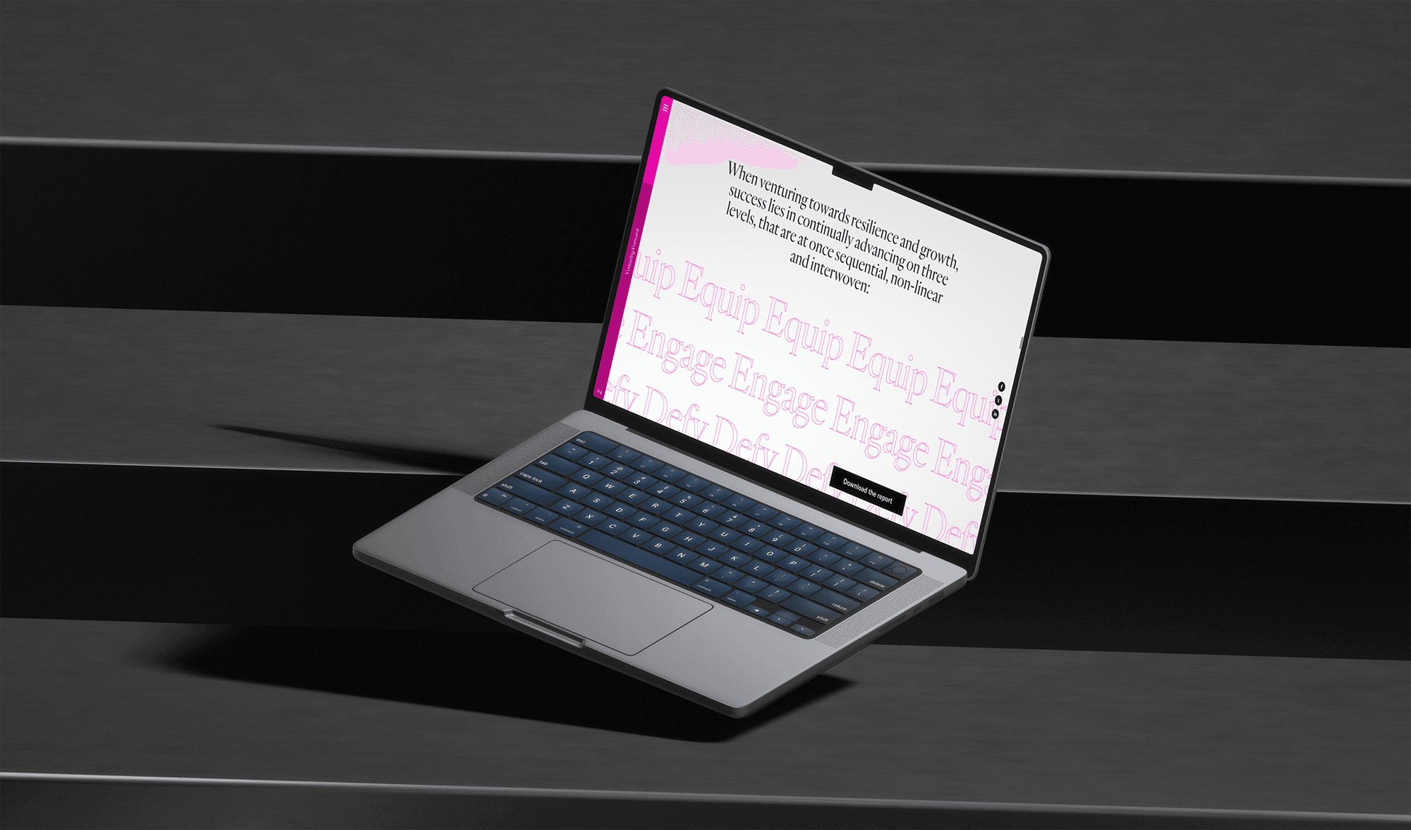 Una página de reporte de Chief Challenges en una laptop, sobre piedra oscura